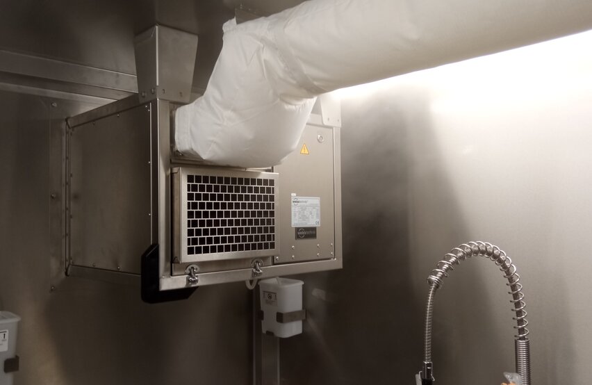  Installed Module R‑3 cooling module by Weiss Defence with connected air duct in a technical interior environment