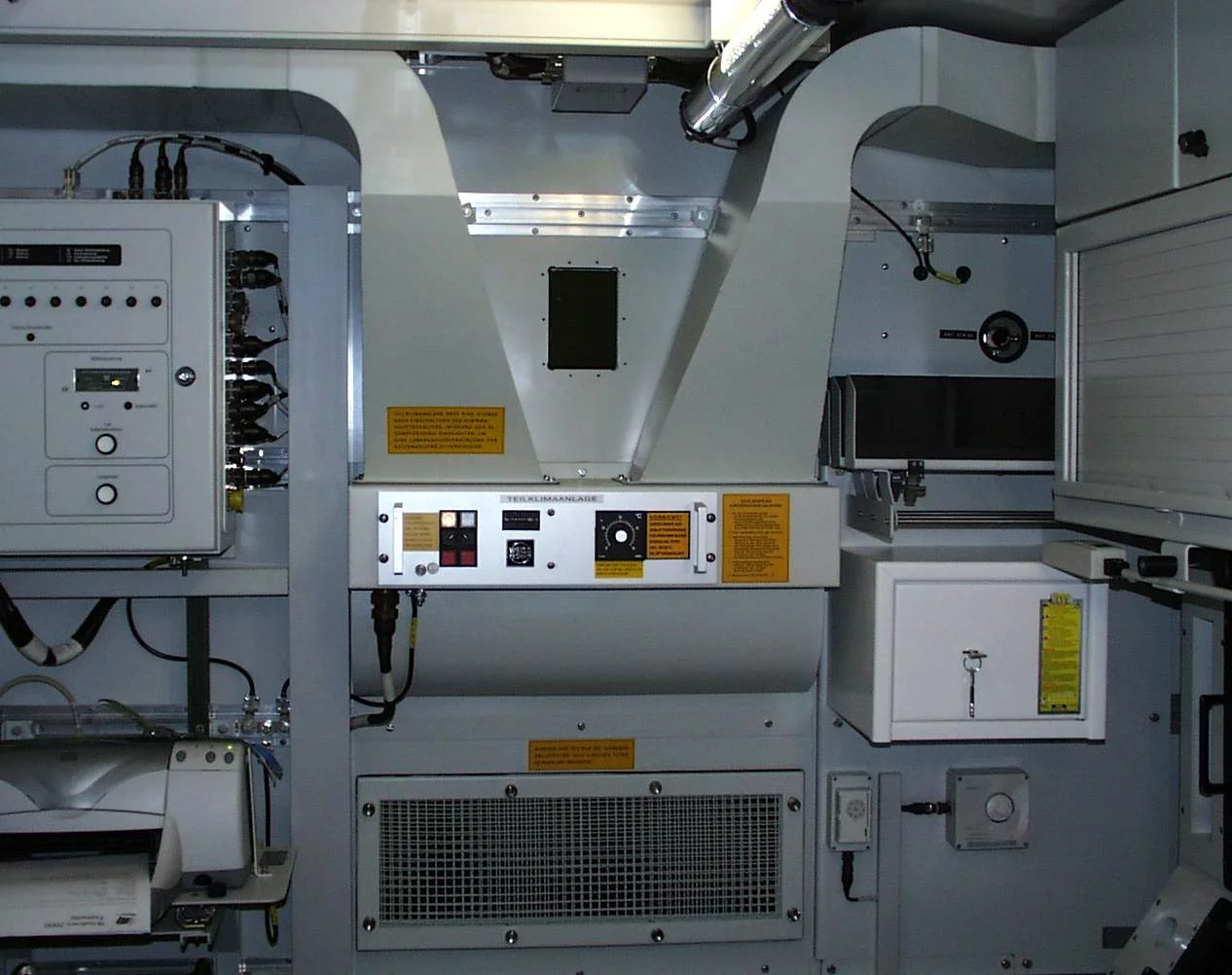  Interior view of the tactical TKA air conditioning unit from Weiss Defence with control system and electrical components.