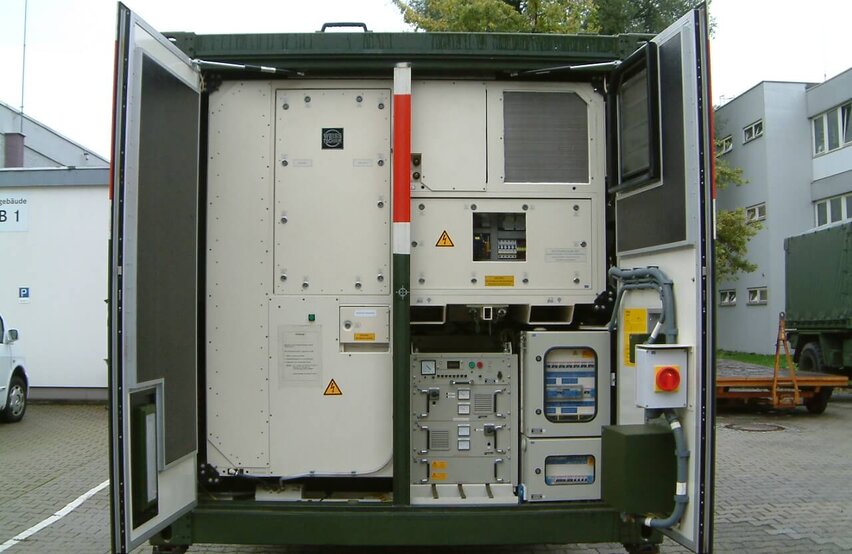  Installed HKE10 hygienic climate compact unit by Weiss Defence inside an open shelter with control systems and technical components