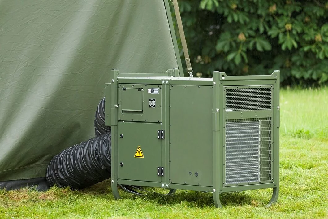 Mobile military Module‑R tent air conditioning unit by Weiss Defence in field operation next to an operational tent.